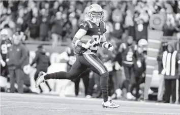  ?? GREG M. COOPER AP ?? Patriots cornerback Marcus Jones returns a punt for a touchdown with 5 seconds left to give New England the win.