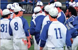  ?? Photos by FRANK CROWE / For the Calhoun Times ?? ( Gordon Central head coach Jeremy Sewell (center) talks to his team between innings on Monday. ( Gordon Central’s Justin Brooks connects for a double during the second inning on Monday.