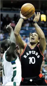  ?? Associated Press photo ?? Toronto Raptors' DeMar DeRozan shoots over Milwaukee Bucks' Thon Maker during the first half of Game 4 of an NBA first-round playoff series basketball game Saturday in Milwaukee.