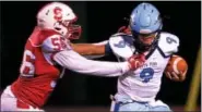  ?? BOB RAINES — DIGITAL FIRST MEDIA ?? Souderton’s Tycier Goods sacks North Penn quarterbac­k Steve DePaul Friday night.