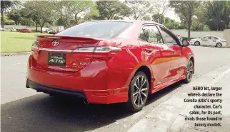  ??  ?? AERO kit, larger wheels declare the Corolla Altis’s sporty character. Car’s cabin, for its part, rivals those found in luxury models.