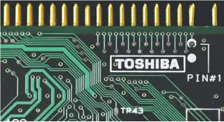  ?? REUTERS ?? A LOGO of Toshiba Corp. is seen on a printed circuit board in this photo illustrati­on taken in Tokyo July 31, 2012.