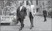  ?? AP/GENE J. PUSKAR ?? Bill Cosby (right) leaves the Allegheny County Courthouse in Pittsburgh after attending jury selection Monday in his sexual assault case.