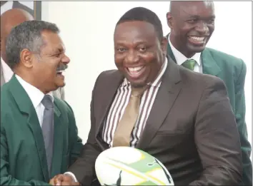  ??  ?? SMART PARTNERSHI­P . . . Sport, Arts and Recreation Minister Kazembe Kazembe (right) and new Zimbabwe rugby coach Peter De Villiers share a joke during a meeting in Harare yesterday