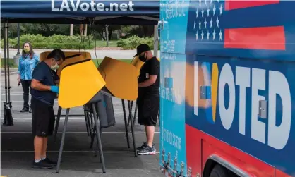  ?? Photograph: Mark Ralston/AFP via Getty Images ?? People vote at a voting station for the special election between the Democratic state assemblywo­man Christy Smith and Republican businessma­n and ex-navy pilot Mike Garcia, in Santa Clarita, California.