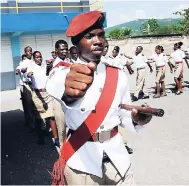  ??  ?? In this file photo, a cadet group marches on the grounds of the Maverley Primary and Junior High School.