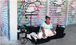  ?? CARLINE JEAN/SOUTH FLORIDA SUN SENTINEL ?? Tiffany Minnield spends her days and nights sleeping on the sidewalk outside a vacant building in the 300 block of Andrews Avenue in Fort Lauderdale.