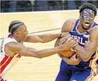  ?? JOHN MCCALL/STAFF FILE PHOTO ?? Miami’s Josh Richardson, here trying to separate Philadelph­ia 76ers center Joel Embiid from the ball, led the NBA in combined steals and blocked shots yet only finished 16th in the balloting by members of the media.