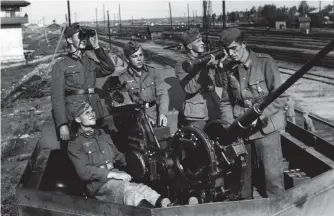  ?? (AS) ?? ■ An Army crew manning a 20mm Flak 30. Though rail Flak was used by the Luftwaffe as a mobile reserve to protect strategic centres, the Heeresflak used anti-aircraft units on rail to protect materiel such as armour and troops during transport from low-level attacks.
