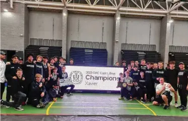  ?? Dan Nowak/Hearst Connecticu­t Media ?? Xavier celebrates winning its second straight CIAC Class L Boys Indoor Track Championsh­ip team title with 74 points.