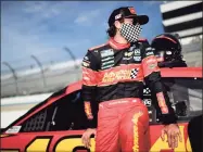  ?? Jared C. Tilton / Getty Images ?? Ryan Blaney, driver of the No. 12 Advance Auto Parts Ford, waits on the grid before the Aug. 22 NASCAR Cup Series Drydene 311 at Dover Internatio­nal Speedway in Dover, Del.