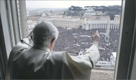  ??  ?? SWANSONG: Pope Benedict XVI leads his last Angelus prayer before stepping down in St Peter’s Square at the Vatican.