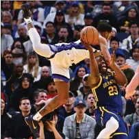  ?? JOSE CARLOS FAJARDO — BAY AREA NEWS GROUP ?? Sacramento Kings' Malik Monk (0) fouls Golden State Warriors' Draymond Green (23) in the third quarter of their NBA game at Chase Center in San Francisco on Thursday.