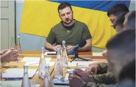  ?? UKRAINIAN PRESIDENTI­AL PRESS OFFICE ?? Ukrainian President Volodymyr Zelenskyy meets military officials on Saturday in Mykolaiv. Zelenskyy also met staff at a city hospital and troops.