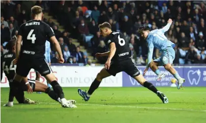  ?? ?? Callum O’Hare slots home through a crowd of Birmingham players to put Coventry 2-0 up. Photograph: Ryan Browne/Shuttersto­ck