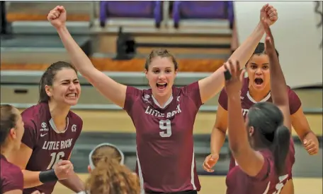  ?? BENJAMIN KRAIN/ Special to The Saline Courier ?? Former Benton Lady Panther and UALR volleytbal­l player Taylor Lindberg, 9, celebrates with her Trojan teammates this past season. Lindberg will head overseas to play profession­al volleyball later this year.