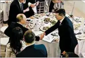  ?? AP ?? Michael Flynn shakes hands with Russian President Vladimir Putin in December 2015. The Trump campaign’s contacts with Russia are under investigat­ion by the FBI.