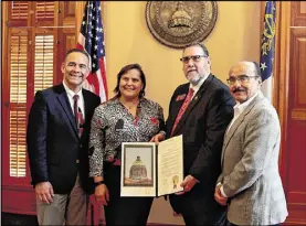  ?? SAMANTHA DIAZ / MUNDOHISPA­NICO ?? Representa­tive Pedro Marin, D-Duluth, recognizes members of the Georgia Hispanic Constructi­on Associatio­n at the state Capitol on Feb. 22.