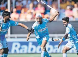  ?? HOCKEY INDIA ?? ▪ Mandeep Singh (centre) celebrates after scoring against the Netherland­s in the Champions Trophy on Saturday. India drew 11 to enter the final.
