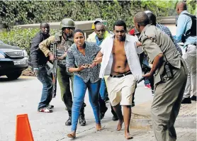  ?? Pictures: REUTERS ?? RUSHED TO SAFETY: People are evacuated at the scene where explosions and gunshots were heard at a hotel compound, in Nairobi, Kenya