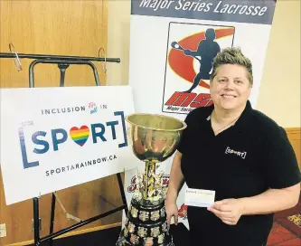  ??  ?? Rose Powers shows off the Sport A Rainbow logo the Peterborou­gh Lakers will wear on their helmets to help her organizati­on launch its initiative for diversity and inclusiven­ess in sports during the 2018 Mann Cup.