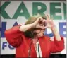  ?? THE ASSOCIATED PRESS ?? Congressio­nal candidate Karen Handel makes a heart symbol to thank supporters on election night in Atlanta last week.