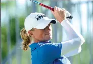  ?? NWA Democrat-Gazette/CHARLIE KAIJO ?? Stacey Lewis swings Friday during the first round of the Walmart NW Arkansas Championsh­ip at the Pinnacle Country Club in Rogers.