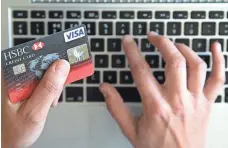  ?? MATT CARDY/GETTY IMAGES ?? Consumers with thin credit files can be rejected when they apply for credit cards with generous rewards.