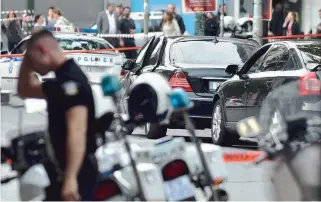  ??  ?? Police cordoned off part of central Athens after a parcel bomb went off in a car carrying former premier Lucas Papademos, hurting him and two other people. All three were taken to the hospital and said to be ‘stable’ late last night.