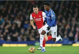  ?? /Gallo Images ?? Demarai Gray of Everton breaks away from Granit Xhaka of Arsenal during their premier league match.
