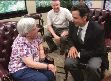  ?? Alan Riquelmy / Rome News-Tribune ?? Betty Blackwell — widow of Hubert T. Blackwell — receives her husband’s medals Monday from U.S. Rep. Tom Graves (right). Blackwell’s son Tom Blackwell watches in the background.