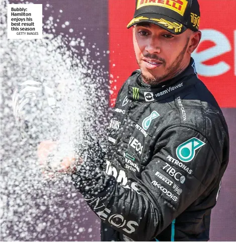  ?? GETTY IMAGES ?? Bubbly: Hamilton enjoys his best result this season