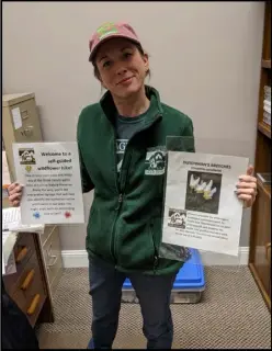  ?? Photo Credit: Will Crawford ?? Heritage Trails Park District Administra­tive Assistant Terry Mcdonald poses on Feb. 21, 2023 with cards for the selfguided
Partly wildflower hike available in late April and early May
Sunny
at the Elizabeth Yahl Kuffner Preserve north of St. Marys.