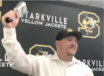  ?? Ryan Phillips, SDN file) (Photo by ?? Luke Adkins rings a Yellow Jacket cowbell on the day he was hired as Starkville High School baseball coach last summer.