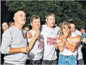  ??  ?? Above, friends and family at a party in their home in Maidenhead, Berkshire, to watch Tom Dean, right, win Olympic gold