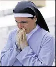  ?? GREGORIO BORGIA / ASSOCIATED PRESS ?? Sister Marjana Lleshi cries Thursday in Ascoli Piceno, Italy. Lleshi escaped when the quake felled her Amatrice convent.