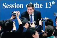  ?? KUANG LINHUA / CHINA DAILY ?? He Lifeng, head of the National Developmen­t and Reform Commission, speaks to reporters after a news conference in Beijing on Wednesday.