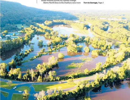  ?? DANA BRIERE/SPARROW DRONE AERIAL SERVICES ?? Nod Road near Route 185 in Simsbury was under water in this photo taken Thursday.
The National Weather Service extended a flood warning for Simsbury through this morning, saying the Farmington River had reached 14.4 feet as of 11:30 a.m. Friday. Flood warning remains