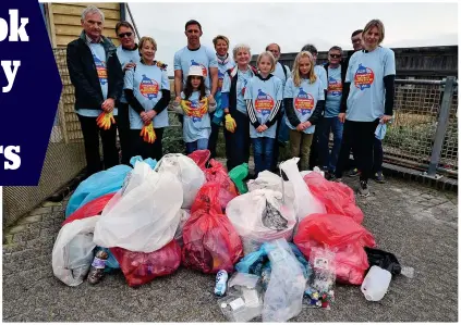  ??  ?? Casually discarded: Volunteers with some of the 30 bags of rubbish they collected on Brighton Beach