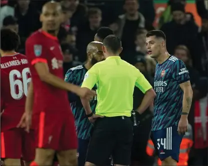  ?? ?? Granit Xhaka was sent off for Arsenal after his last-man lunge caught Liverpool forward Diogo Jota