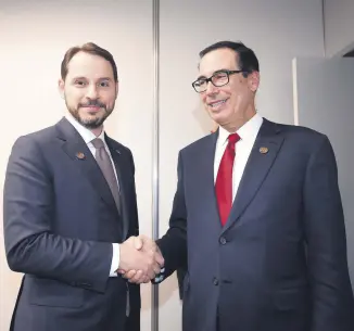  ??  ?? Treasury and Finance Minister Berat Albayrak (L) meets with U.S. Secretary of Treasury Steven Munchin on the sidelines of the G20 Meeting of Finance Ministers in Buenos Aires, Argentina, July 21, 2018.