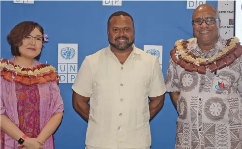  ?? Photo: Ronald Kumar ?? From left: United Nations Developmen­t Programme (UNDP) Resident Representa­tive Munkhtuya (Tuya) Altangerel, Drua Innovation Small Grant’s Scheme Prize Awards recipient, Panapasa Daunakamak­ama of Juice Fiji, with Deputy Prime Minister and Minister for Trade Manoa Kamikamica at UNDP Suva office on February 15, 2024.