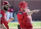  ?? LYNNE SLADKY — THE ASSOCIATED PRESS ?? Philadelph­ia Phillies relief pitcher Adam Morgan, left, talks with catcher Andrew Knapp, right, at the team’s spring training camp, last week in Clearwater, Fla.