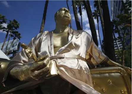  ??  ?? Fallen Mogul Street artists created “Casting Couch,” a statue of Harvey Weinstein on Hollywood Blvd. Revelation­s of his alleged misconduct set off a chain of similar accusation­s.