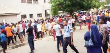  ?? Photo: NAN ?? Some Catholic faithful during a protest demanding for the whereabout­s of the founder of Adoration Ministries, Rev. Fr. Ejike Mbaka, at the residence of the Catholic Bishop of Enugu yesterday.