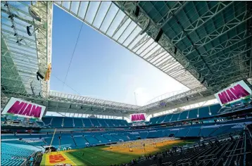  ?? ASSOCIATED PRESS ?? GROW LIGHTS COVER A PORTION of the grass field inside Hard Rock Stadium Tuesday in Miami Gardens, Fla., in preparatio­n for the NFL Super Bowl 54 football game.