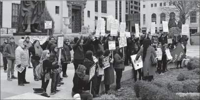  ?? [JIM WOODS/DISPATCH] ?? Demonstrat­ors rally outside Columbus City Hall on Monday while the city council met inside. The crowd was protesting the scheduled sentencing­s Tuesday of three members of #BlackPride­4. The group’s four black, transgende­r and queer members were...