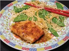  ?? LINDA GASSENHEIM­ER/ TRIBUNE NEWS SERVICE ?? Teriyaki salmon with pasta and snow peas.