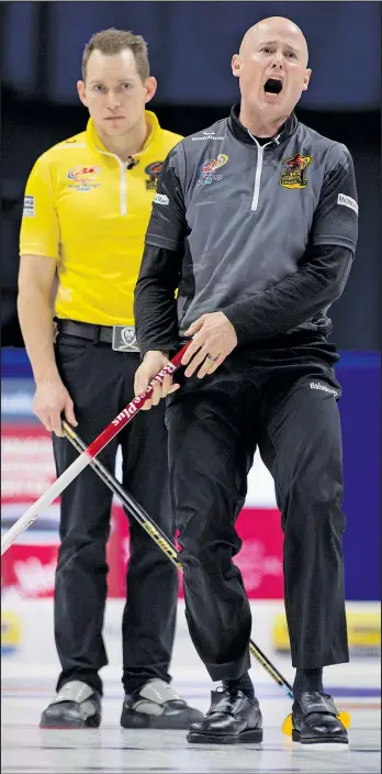  ?? MICHAEL BURNS/PHOTO ?? Skip Kevin Koe shouts to his front end as Team McEwen lead Denni Neufeld looks over his shoulder during last night’s men’s final in Ottawa.