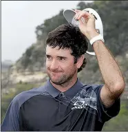  ?? AP/ERIC GAY ?? Bubba Watson tips his cap after winning the Dell Technologi­es Match Play on Sunday in Austin, Texas. Watson defeated Kevin Kisner 7 and 6 for his second World Golf Championsh­ip title.